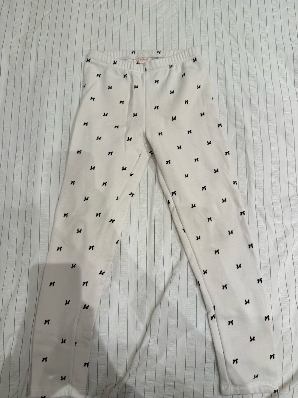 Cat & Jack Cream Leggings with Black Bow Print